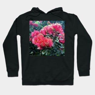 Red flower blossoms amid lush green foliage Hoodie